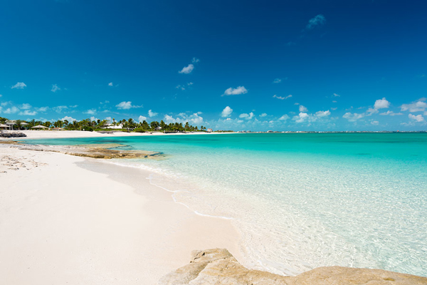 The white sand and crystal clear sea on Grace Bay Beach, Turks and Caicos Islands.